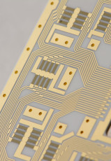 Thin film fine lines, resistors, and plated through holes