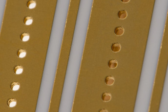 Plated through holes in thin film substrate