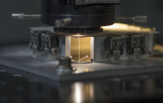 Laser machining of thin film substrate materials